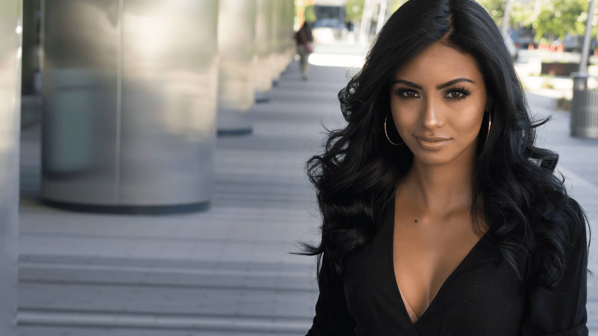woman in black dress smiling o